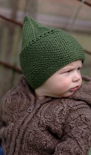 Baby in a green pixie hat