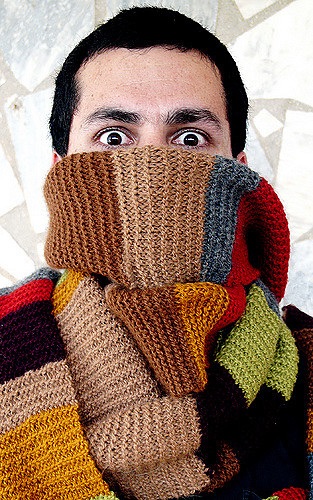 Striped scarf covering a face