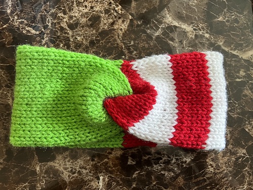 Green red and white ear warmer