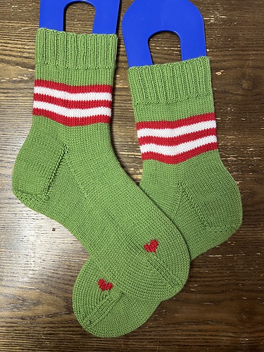 Green socks with red and white stripes