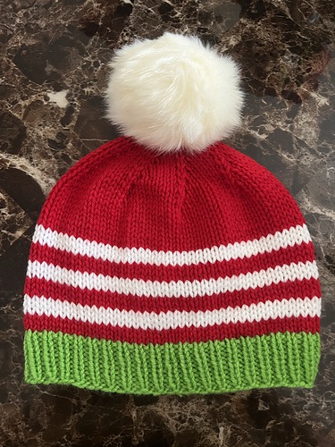 Red white and green striped hat with white pompom
