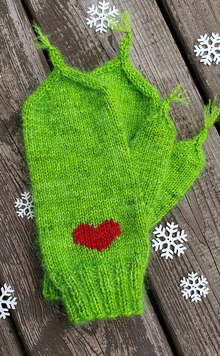 Green mittens with a red heart