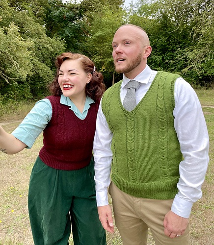 Two people wearing cabled sweater vests